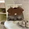 Conjunto de Verão 2026 para Meninas Novo Conjunto de Duas Peças Moda Coreana Conjunto de Saia Jeans de Manga Curta Estiloso Versátil Tendência Item Quente