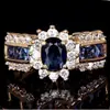 Anillo Transfronterizo de Joyería Incrustado con Circonita Azul Comercio Electrónico Transfronterizo Moda Europea y Americana Anillos para Hombres y Mujeres Deseo Venta Caliente Al por Mayor
