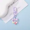 Chaveiro Pingente Urso de Resina Fofo com Laço de Bolinhas Coloridas Decoração de Sacola de Presente Cultural e Criativa DIY