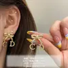 Brincos de Laço Coreanos, Brincos de Luxo Leve e de Alta Qualidade para Mulheres, Design de Nicho Moderno, Brincos Modernos e Elegantes, Atacado