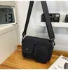 2025 Outono Marca da Moda Retro Bolsa Pequena Feminina Bolsa de Pano de Alta Qualidade Versátil Casual para Casal Bolsa Transversal Masculina Bolsa de Ombro