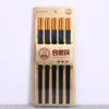 Palillos de aleación de diamante flor de ciruelo empaque blíster palillos familiares cabeza dorada de aleación palillos antibacterianos resistentes a altas temperaturas suministro