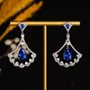 Nuevos pendientes de moda transfronterizos europeos y americanos con incrustaciones de circonita exquisita y ultrabrillante, pendientes de botón y colgantes versátiles y elegantes para mujer