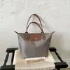 Bolsa de Mão Estilo Coreano Feminina 2026 Nova Cor Blocada Design Tote Bolsa Feminina Moda de Nicho Grande Capacidade Bolsa de Ombro