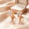 Pendientes de cruz transfronterizos europeos y americanos de nicho Xuping, pendientes de flor de cuatro hojas geométrica de aleación de cobre, pendientes elegantes de lujo ligero, venta al por mayor de joyería