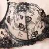 Conjunto de lencería europeo y americano de estilo transfronterizo con encaje negro bordado, que incluye un tanga sexy transparente y un conjunto de dos piezas, disponible para venta al por mayor