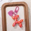 Perro globo de resina de gelatina con forma de corazón de color caramelo hebilla de puerta llavero de cuentas DIY decoración de accesorio para auriculares