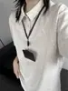 2025 Nuevo Suéter de Punto Holgado de Manga Corta con Cuello Polo para Hombre y Mujer Ropa Interior de Punto de Manga Media Ropa Exterior Casual Hombro Derecho