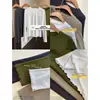 Estilo popular: una camiseta de manga larga de color liso, holgada y que estiliza, con un bajo con volantes, perfecta para usar sola o como capa interior.; nuevo para otoño 2026