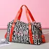 2023 nueva bolsa de viaje de gran capacidad para hombre y mujer, bolso de mano con separación húmeda y seca, bolsa deportiva Oxford para Fitness, venta al por mayor
