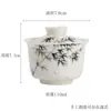 Dinastías Tang y Song Mu Cangzhai Colaboración Jade Arcilla Porcelana Blanca Pintado a Mano Tapa de Bambú Cuenco Juego de Té Kung Fu para Uso en Casa Cuenco de Té Cerámico de Bambú