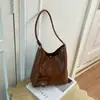 Bolso tejido vintage de alta gama transfronterizo para mujer, nuevo bolso de hombro de moda 2026 para ir al trabajo, bolso tipo cubo de mano de gran capacidad