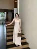 Vestido de tirantes combinado con un cárdigan de manga larga del mismo color, conjunto con copas extraíbles, nuevo estilo de otoño, al por mayor