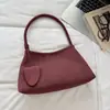 Bolso de hombro o axila de color liso con patrón tejido para el día a día, nuevo modelo otoño 2026, alto valor estético, sensación relajada, bolso de mano de nicho, moderno