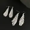[Pluma Inteligente] Ganchos para Orejas de Pluma de Cisne Hechos a Mano con Cuentas, Pendientes Brillantes, Pendientes de Borla Geniales para Mujeres