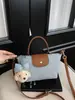 Mini Bolso Tipo Dumpling de Parches de Mezclilla para Mujer 2026 Nuevo Estilo Coreano Bolso Tote de Nicho con un Toque de Alta Gama, Se Puede Usar en el Hombro, Cruzado o como Bolso de Mano