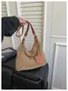 Nueva bolsa tejida de comercio exterior transfronteriza, bolso tote casual de un solo hombro, bolsa de paja de gran capacidad, bolso de playa de moda calado para mujer