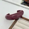 Joyería Transfronteriza Europea y Americana, Pulsera Abierta de Moda Lujo Ligero Rojo Brillante, Pulsera de Resorte Curvado de Diseño Simple para Mujer