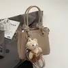 Bolsa de Mano de Moda para Mujer al por Mayor 2026 Nueva Bolso Cuadrado Pequeño Simple Versátil de Hombro Cruzado de Moda