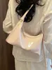 Bolso de axila texturizado transfronterizo para mujer, nuevo modelo 2026, bolso simple de media luna, bolso versátil para hombro y cruzado
