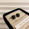 Pendientes de botón de camelia esmaltados en negro nuevos de estilo francés, pendientes de temperamento simple, lujo ligero, sensación de alta gama, adornos para orejas con aguja de plata 925
