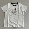 A textura é nada mais que design tridimensional escova de dentes bordada linha vermelha corda cachorrinho manga curta gola redonda estilo casual T-shirt 90% algodão feminina