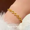 Pulsera de trébol de cuatro hojas hueca superbrillante color arena dorada de larga duración resistente al desvanecimiento para mujer nicho lujo ligero tacto de alta gama cuentas facetadas
