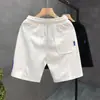 Verano 2023 nuevos shorts blancos estampados marca de moda para hombre pantalones deportivos holgados de cinco puntos pantalones de viaje para hombre Pantalones de playa
