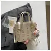 Bolso de mano de cubo de alta gama con relieve de estilo coreano, moderno y popular, versátil para ir al trabajo, diseño de nicho, bolso cruzado casual para mujer