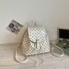 Mochila escolar de nicho estilo coreano Shuai Mi Jia para niñas, nueva bolsa de viaje informal de alta moda de lunares 2026, mochila elegante