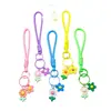 Venta al por mayor de pequeños, frescos, estilo coreano, flor de girasol acrílica, flor de goma suave, cordón trenzado hecho a mano, accesorios para cordón de teléfono