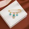 Broche de Borla Ojo del Diablo con Pedrería Creativa Europeo y Americano para Mujer, Pin de Estilo Vintage para Ceñir la Cintura de Suéter Ojo Azul de Alta Gama