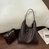 Bolso de hombro de gran capacidad para comercio exterior para mujer, nuevo bolso de axila de nicho vintage 2026, bolsa tote versátil de alta gama para madre e hijo