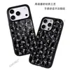 Funda de teléfono floral con rayas verticales de fondo negro para Apple 17promax funda de cristal negro iPhone18pro comercio exterior al por mayor