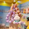 Conejito creativo cara garabato animal pequeño llavero colgante femenino lindo pareja llavero bolsa teléfono móvil colgante venta al por mayor