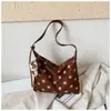 Bolso de gran capacidad para mujer, nuevo y popular bolso de hombro y axila de lunares 2026, bolso de mano pequeño elegante y único
