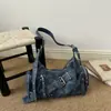 Bolso de moto retro de nicho para chica hot, nuevo modelo 2026, bolso de hombro/cruzado versátil y elegante, bolso tote de gran capacidad de alta gama