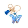 Llavero Colgante Temático Océano Azul con Borla de Estrella de Mar, Llavero de Resina Encanto para Bolso con 26 Letras