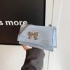Bolso de moda de estilo coreano para mujer, nuevo bolso de viaje sencillo de color sólido con diseño de mariposa, pequeño bolso cuadrado, elegante bolso cruzado con cadena, 2024