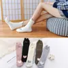 Calcetines para mujer engrosados con forro de felpa calcetines de rizo calcetines de tubo cálidos de invierno absorbentes de sudor transpirables color liso calcetines con base de toalla moda