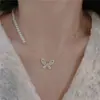 Colar de borboleta com franja de pérola, estilo doce e cool, luxo leve para mulheres, elegante e doce, moda nicho de alta qualidade com um toque jovem