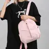 Mochila escolar para niñas 2026 principios de otoño nuevo estudiante color liso simple ligera mochila de viaje de moda versión coreana alta apariencia bolsa de doble hombro