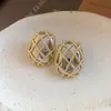 Brincos de Tarraxa com Pingente Oval em Grade de Agulha de Prata Transfronteiriços Europeus e Americanos Luxo Leve Sentido de Alta Qualidade Design Versátil Brincos Acessórios para Orelha Feminino