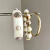 Pulsera de cadena circular hueca metálica floral estilo europeo y americano, moderna y versátil, lujo ligero con un toque de alta gama, joyería versátil al por mayor