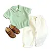 Estilo Coreano Camisa de Punto para Niños Verano 2026 Nueva Verde Bordado Hueco Cuello Polo Manga Corta Pantalones Casuales para Niños Modernos