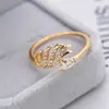 Ebay suministro Joyería europea y americana moda dinámica anillo forma de alas cobre chapado en oro micro incrustado circonio fábrica en stock