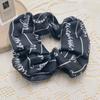 Nuevo tejido de letras banda para el cabello de intestino grueso estilo Chanel blanco y negro que combina con todo simple anillo de intestino grueso elegante cuerda para el cabello francesa adorno para la cabeza