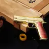 Juguete de pollo para comer M226 banda de goma dorada juguete aleación M226 pistola puede explotar Modelo 10cm
