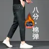 Jeans elásticos de 8/9 de largo para hombre Guangzhou Xintang, modernos y versátiles para primavera y otoño, de moda para personas bajas de 160 cm