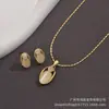 Paquete Individual Ojo de Gato Blanco Cadena de Oro Real Conjunto de Colgante y Aretes para Mujer Collar de Oro Regalo Estilo Nuevo
